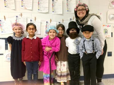 Ms. Ardovini and her students reach 100 years old.